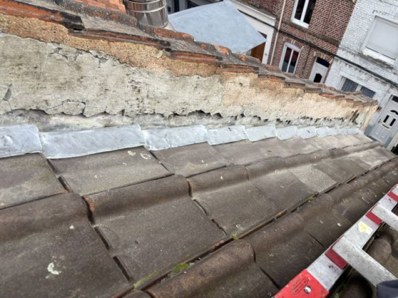 Réparation de cheminée avec reprise des fissures et réfection des solins en mortier hydrofuge à Valenciennes